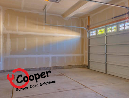 Empty garage interior ready for a new door installation